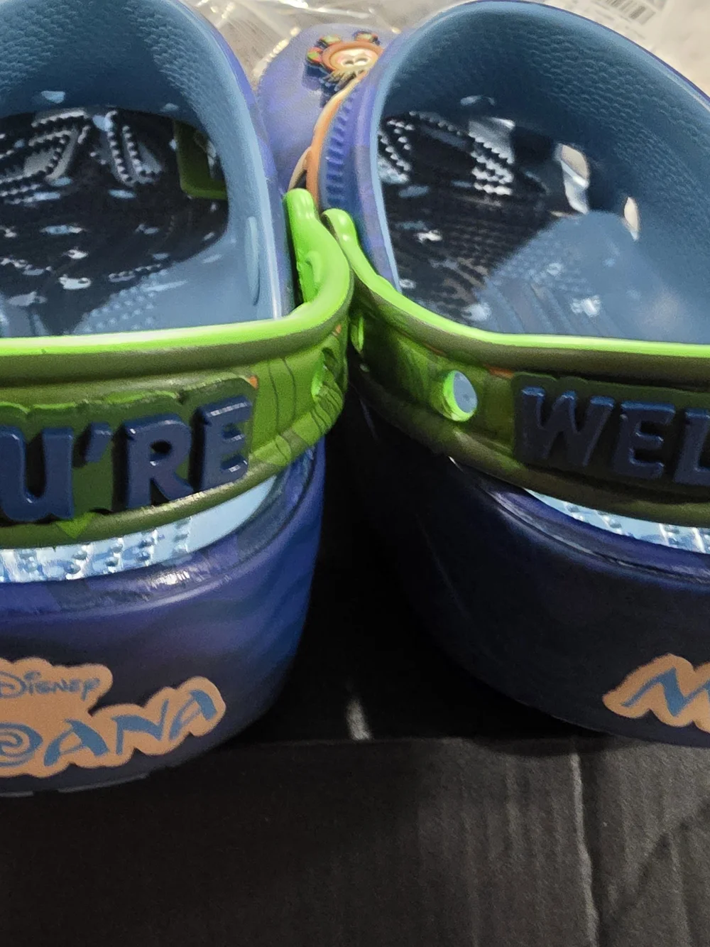 CROCS Kids Blue Clog Sandals with Neon Green Straps and Decorative Charms